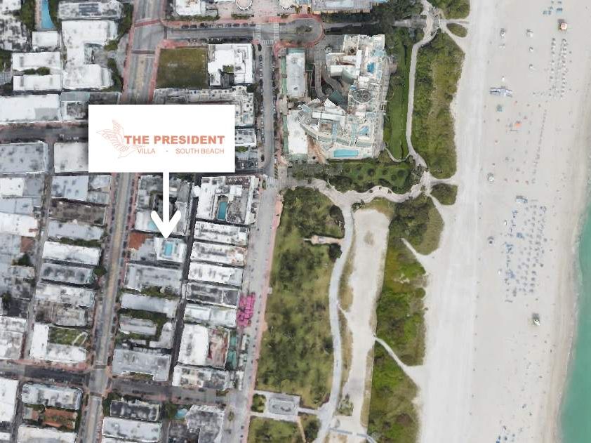 Satellite view showing urban area with a hotel labeled "The President," adjacent to a beach and coastline.